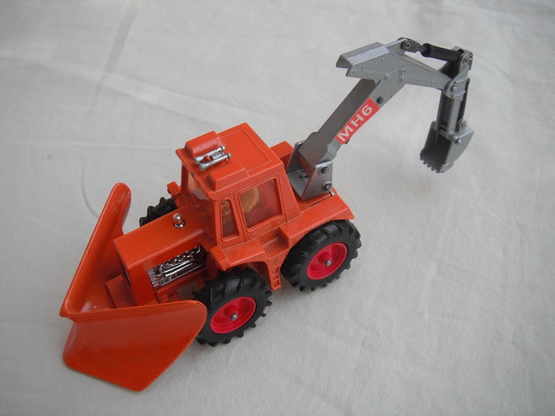 7. Orange tractor/org plow/sil backhoe &amp; scoop/clear windows/thick tires/dk.red hubs/dk.red int/1972 England cast/MH6 labels.