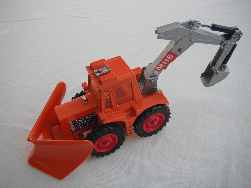 3. Dk.org tractor &amp; plow/sil backhoe &amp; scoop/lt.amber wind/thin tires/dk.red hubs/dk.red int/1972 England cast/sil plate above tow hook/MH6 lbls.