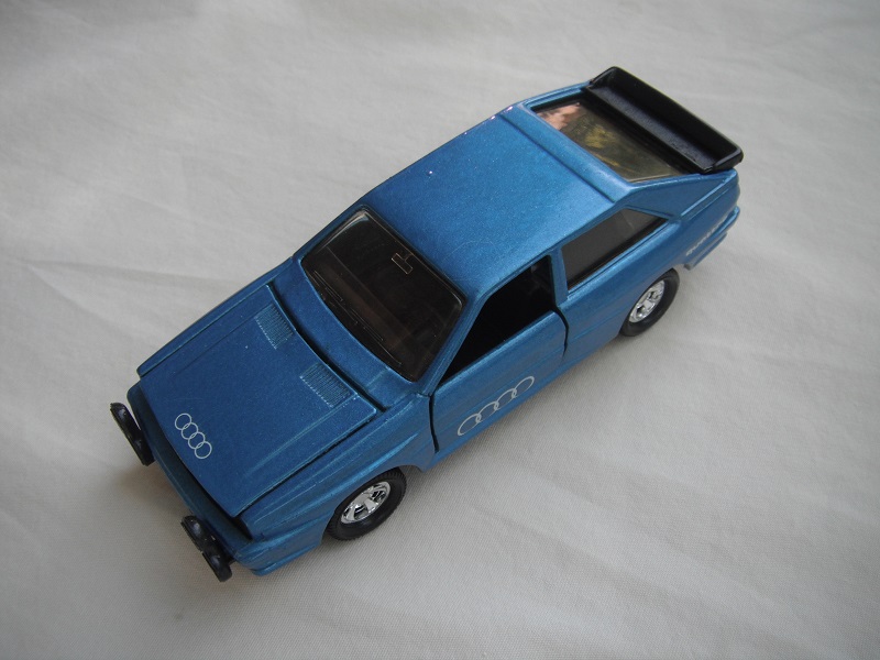 22.Blue body/black small &quot;Macau&quot; base/5 spoke mag wheels/lt.amber windows/amber headlights/&quot;Audi logo on hood &amp; side doors.