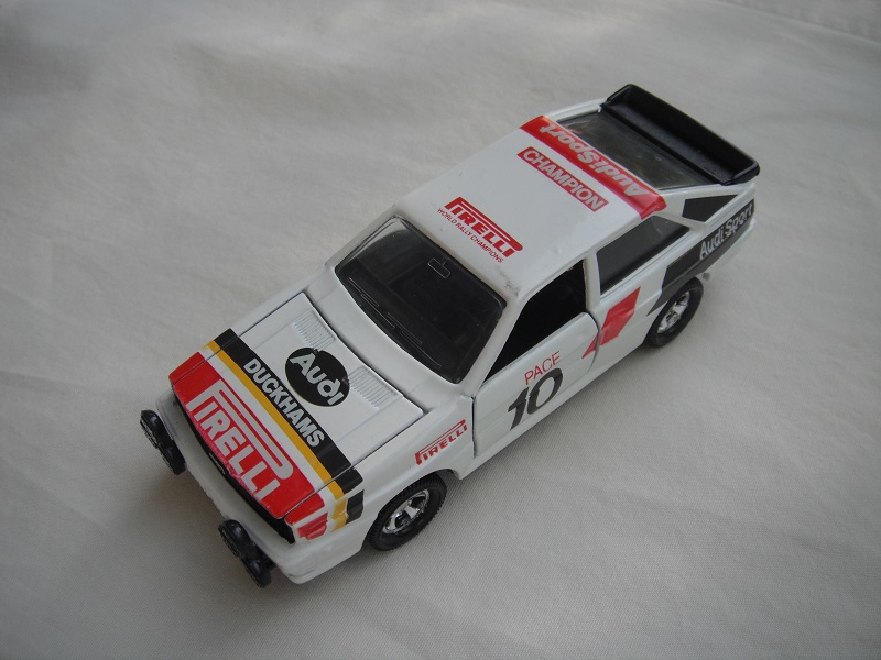 17.Off white body/black England base/5 spoke mag whls/clear windows/&quot;Audi Duckhams Pirelli&quot; on hood/&quot;Pace 10&quot; on side doors/dk.brown &amp; red stripes.