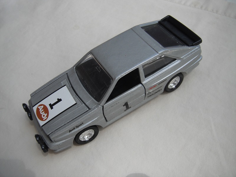 6. Silver body/black England base/8 dot disc wheels/clear windows/Audi &quot;1&quot; on hood and side doors.