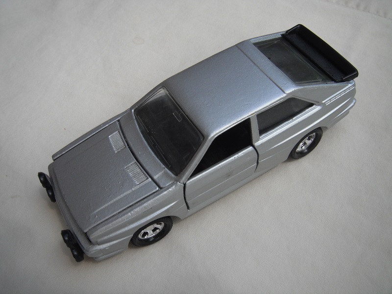 2. Silver body/black England base/5 spoke mag wheels/clear windows/black interior/no logos.