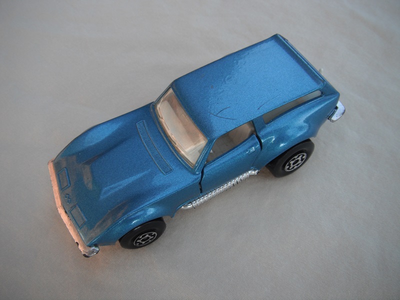 7. Metallic blue body/silver base/Superkings/MC wheels/clear windows/white interior/no labels.