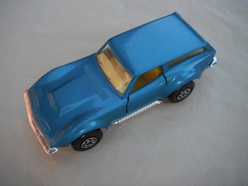 6. Metallic blue body/silver base/Speedkings/MC wheels/clear windows/yellow interior/no labels.