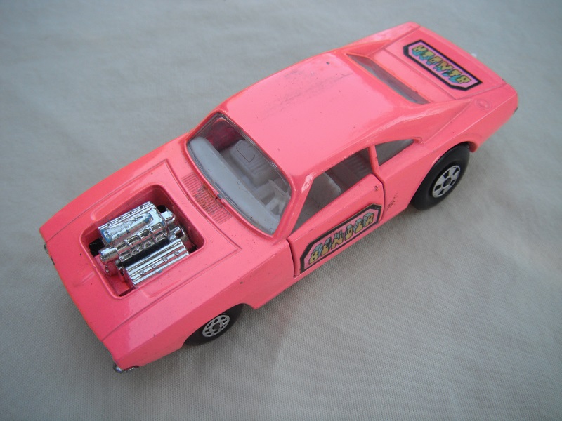 4. Lt.pink body/unpainted base/clear windows/spiro &amp; five spoke wheels/&quot;Binder&quot; labels on side doors &amp; rear.