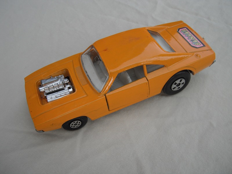 1. Lt.orange body/unpainted base/clear windows/spiro &amp; five spoke wheels/&quot;Binder&quot; label on rear only.