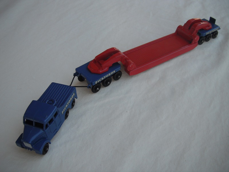 5. Blue tractor/black base/KBPW/silver radiator/bright red &amp; blue trailer/KBPW/unpainted tow bar/Pickfords decals.