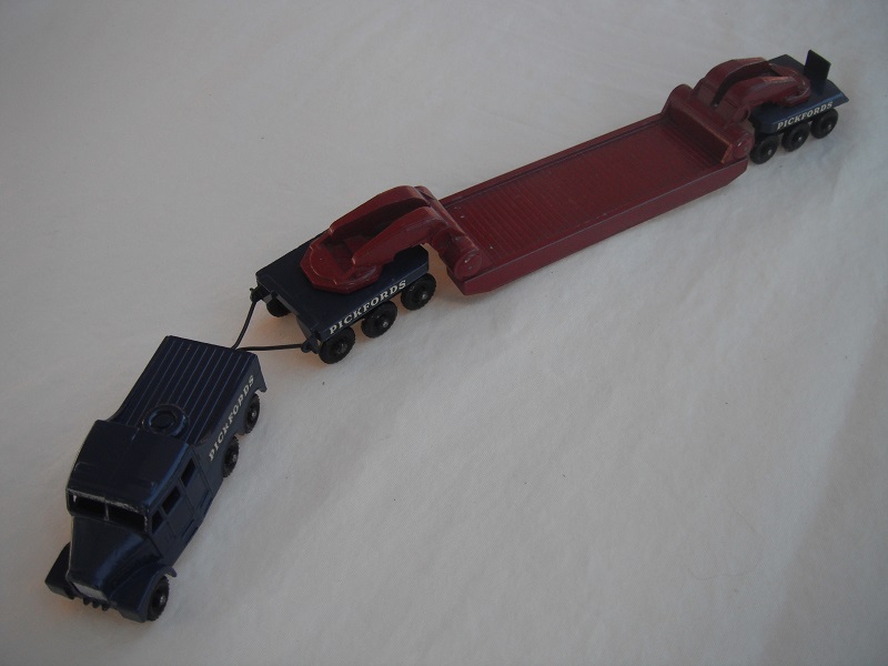 2. Dk.blue tractor/black base/KBPW/silver radiator/maroon &amp; dk.blue trailer/KBPW/unpainted tow bar/Pickfords decals.