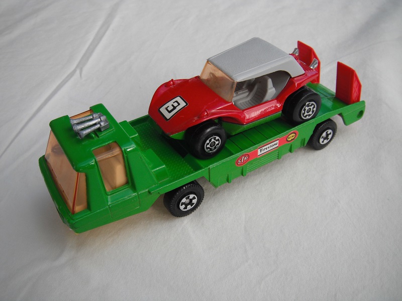 8. Green body/typ b/yel &amp; grn K13-2 &amp; K114 base/lt.amber wind/wht int/red ramps/chrm lts/Firestone lbls/K37 Sandcat red&amp;grn/gry roof/amber windshield.