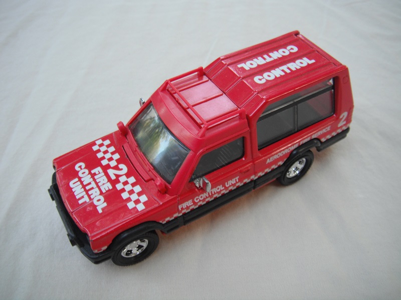 12.Red body/white checkers/red plastic base/Macau/clear windshield/clear windows/black interior/&quot;Fire Control unit 2&quot; on hood, sides &amp; top.