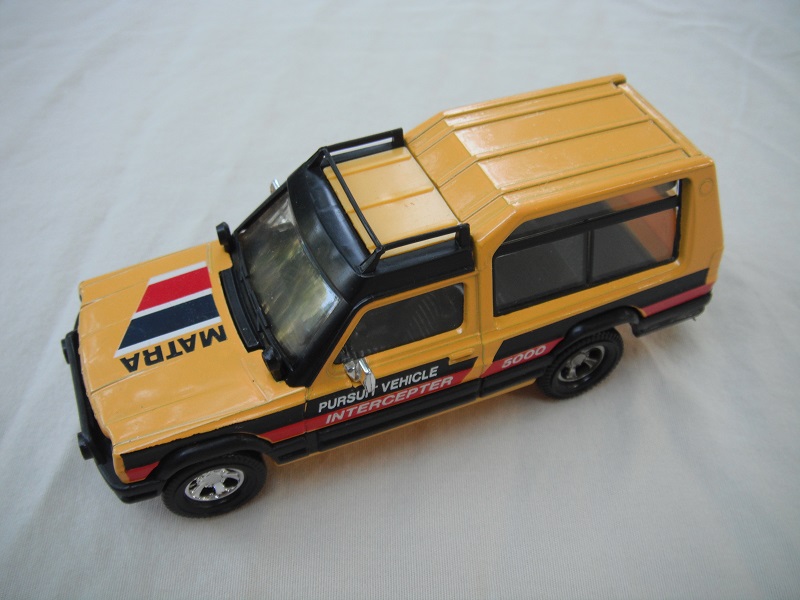 9. Yellow &amp; black body/yellow metal base/England/clear windows/black interior/&quot;Matra&quot; on hood, &quot;Pursuit vehicle 5000 Interceptor&quot; on sides.