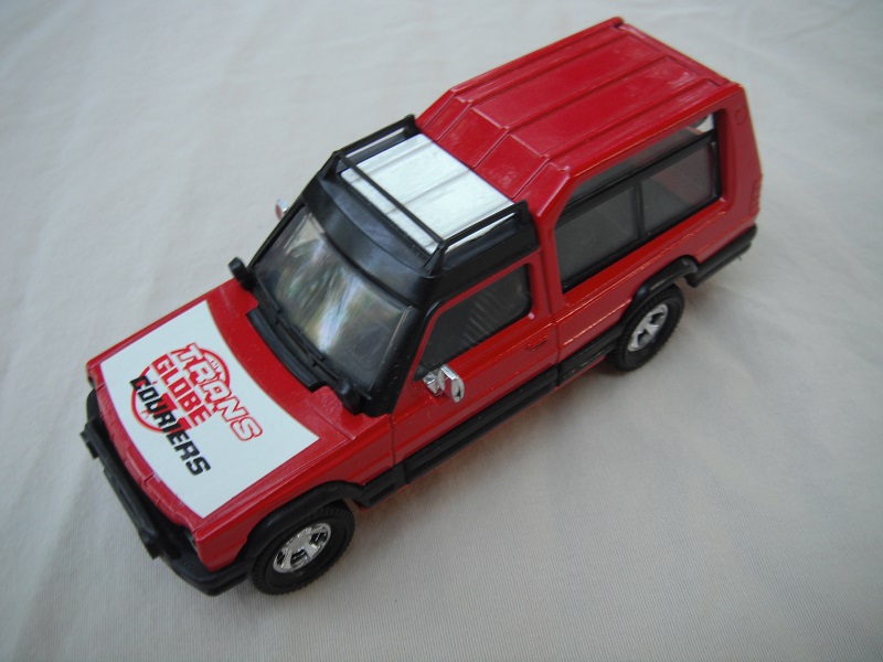 3. Red body/wht &amp; red roof/red metal base/England/clear windshield/clear windows/black interior/&quot;Trans Globe Couriers&quot; on hood.