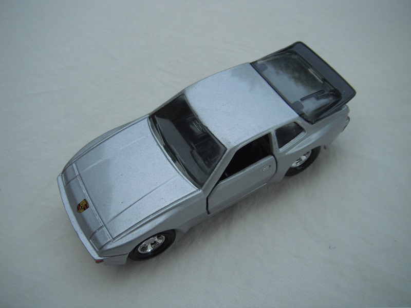 23.Silver body/black base/China/5SM wheels/clear windows/clear rear/black int/black steering/orange painted side lights.