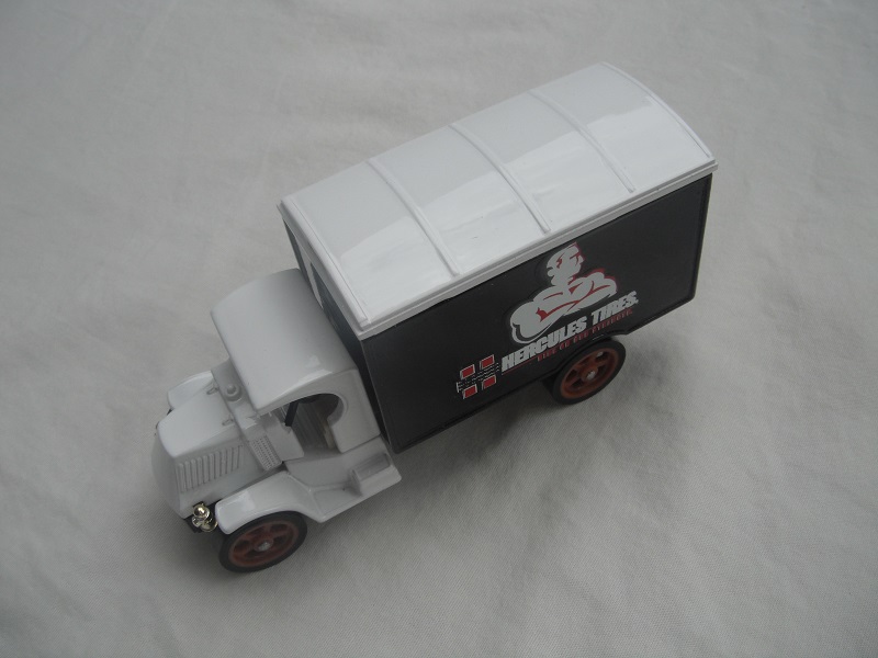 6. White cab/white roof/black body/black base/Macau/brown wheels/light tan seat/short label.