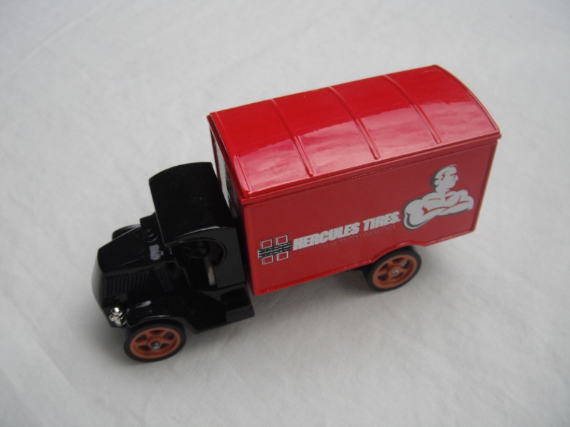 3. Black cab/red roof/red body/dark blue base/England/brown wheels/light tan seat/long label.