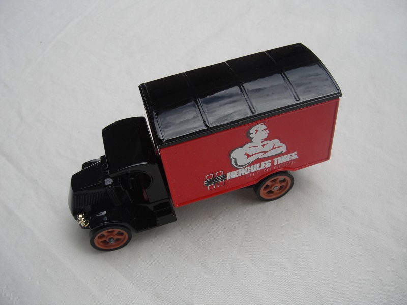 2. Black cab/black roof/red body/dark blue base/England/brown wheels/burgundy seat/short label.