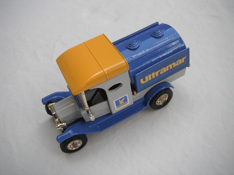 4. Model T Tanker/gray body/yellow roof/blue tank w/side panels/blue base/Matchbox England/12 spoke brass wheels.