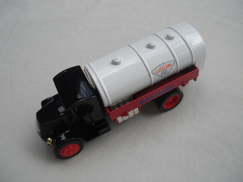 4. Mack AC Tanker/Black cab/red bed/white tank/black base/Macau/type one red wheels.