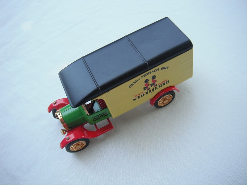 5. Ford Model TT Van/Green cab/yellow body/black roof/red base/China/12 spoke gold wheels/red seat.