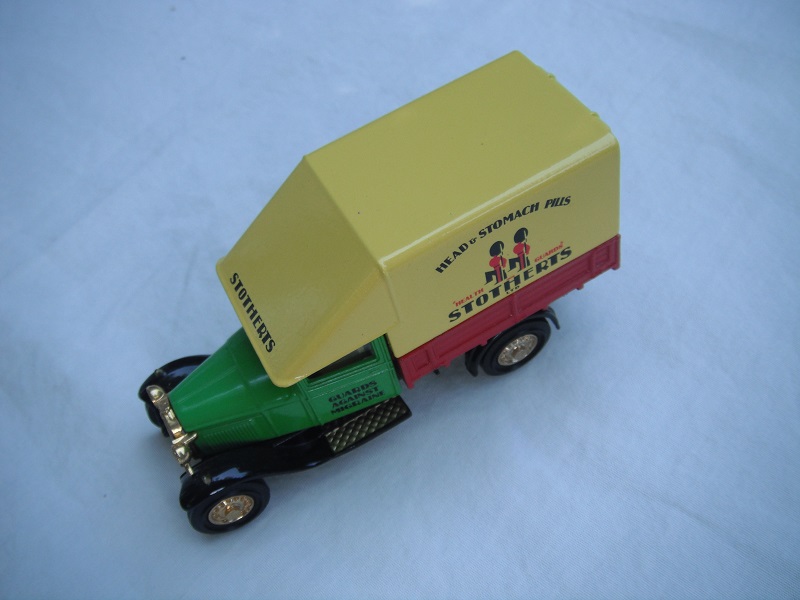 3. Ford AA truck/Green cab/red bed/yellow canopy/black base/China/solid gold wheels/yellow seat.