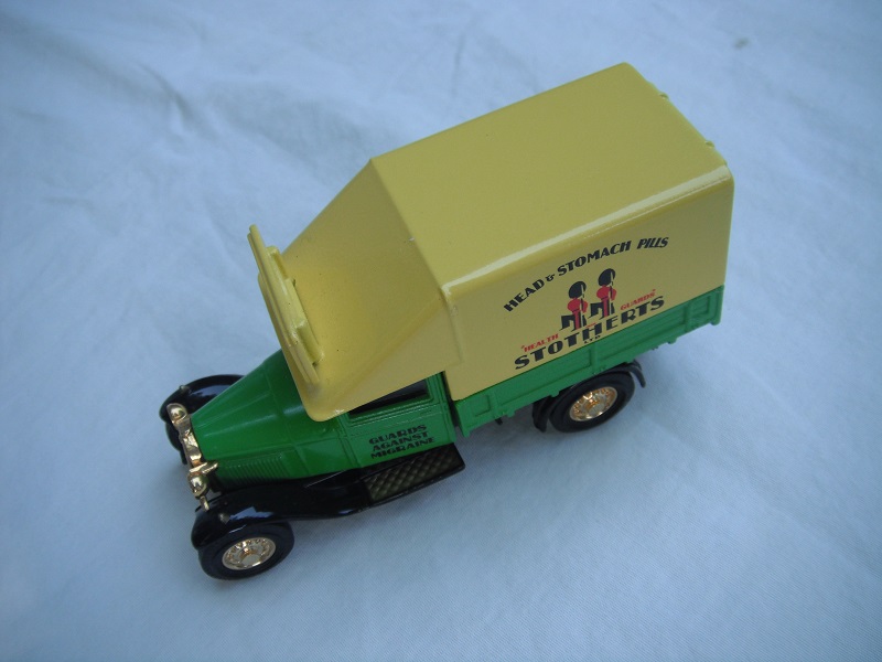 1. Ford AA Truck/Green cab/green bed/yellow canopy w/roof blade/black base/China/solid gold wheels/black seat.