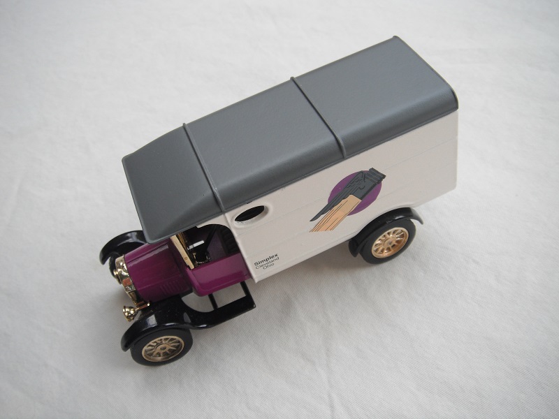 2. Model TT van/Purple cab/white body/gray roof with underside lug/black base/China/12 spoke gold wheels/gray seat.