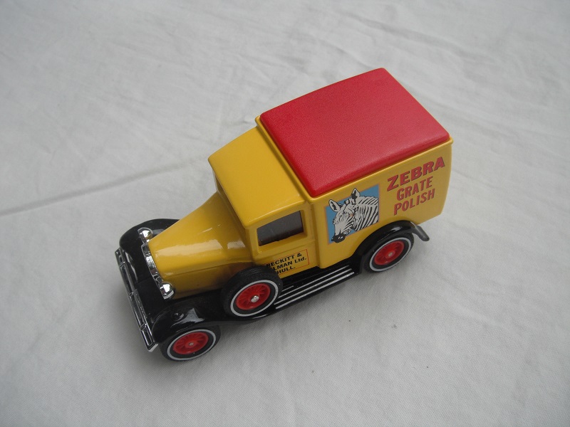 3. Yellow body/red roof/black base/China/12 spoke red wheels/Zebra to front.