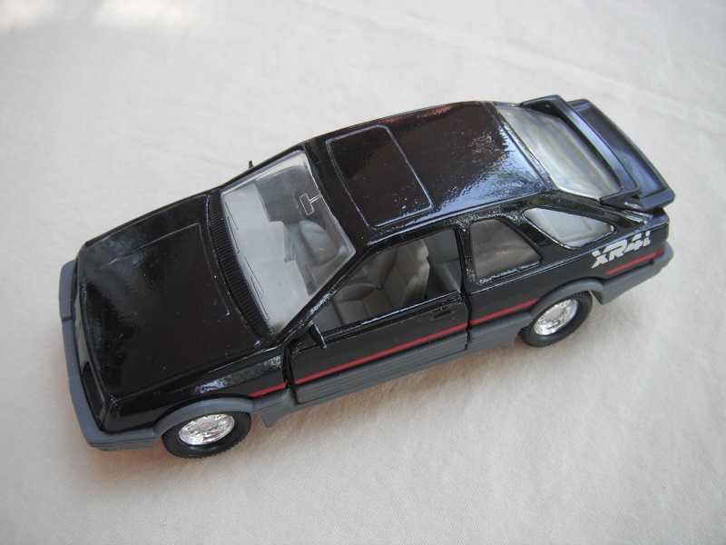 28. Black body &amp; spoiler/gray China base/8 dot chrome disc wheels/clear windows/gray int/gray steering wheel/red stripe/large XR4i.
