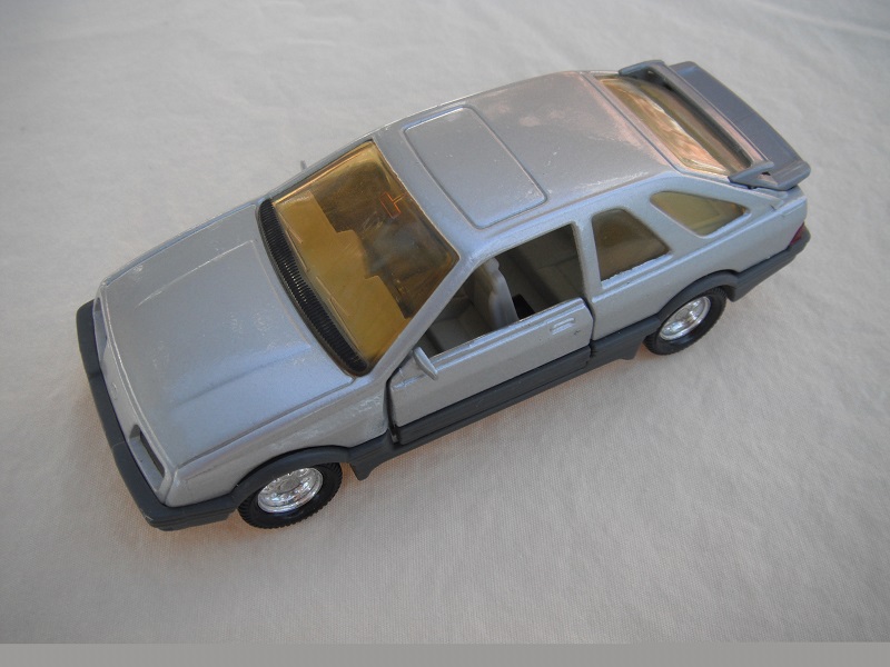 24. Silver body/gray spoiler/gray England base/8 dot chrome disc wheels/amber windows/lt.gray int/black steering wheel.