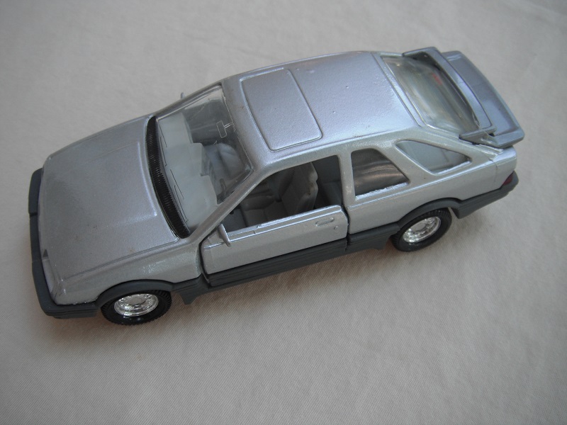 23. Silver body/gray spoiler/gray England base/8 dot chrome disc wheels/clear windows/lt.gray int/black steering wheel.