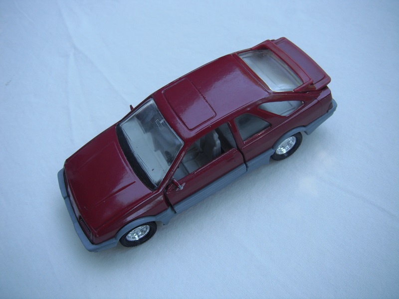 22. Plum body &amp; spoiler/gray England base/8 dot chrome wheels/clear windows/gray int/black steering wheel.