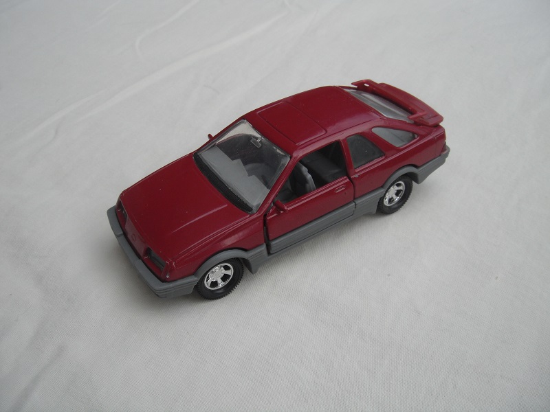 21. Plum body &amp; spoiler/gray England base/5 spoke mag wheels/clear windows/gray int/black steering wheel.