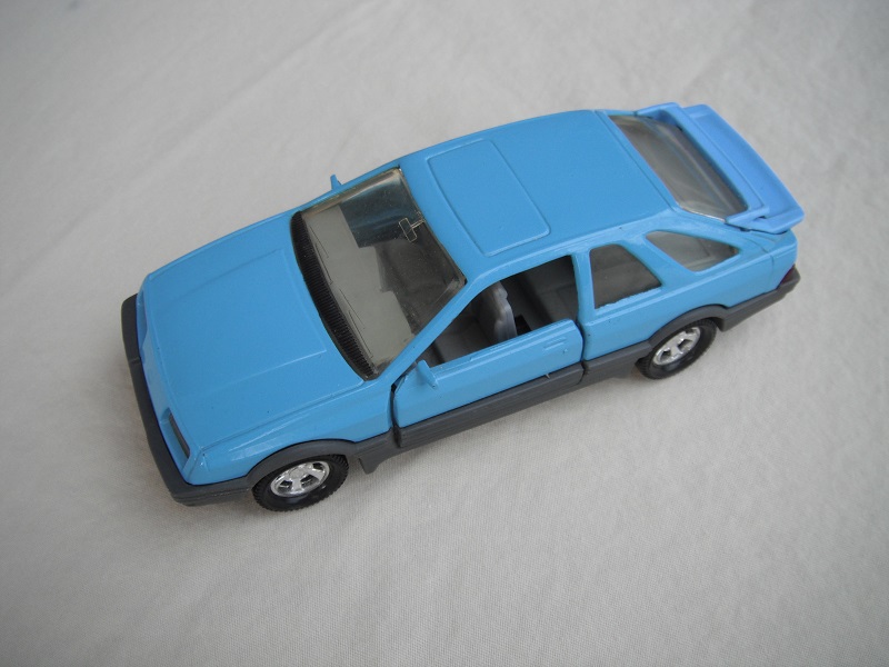 18. Lt.blue body &amp; spoiler/gray England base/5 spoke mag wheels/lt.amber windows/lt.gray int/black steering wheel.