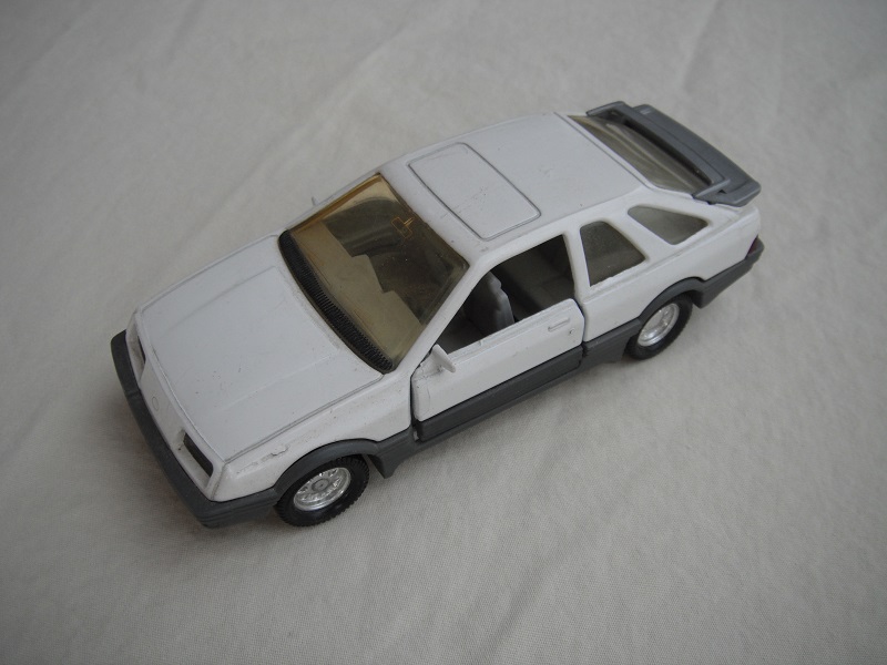 16. White body/gray spoiler/gray England base/8 dot chrome disc wheels/lt.amber windows/gray int/black steering wheel.