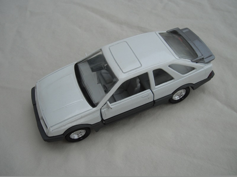 15. White body/gray spoiler/gray England base/8 dot chrome disc wheels/clear windows/lt.gray int/black steering wheel.