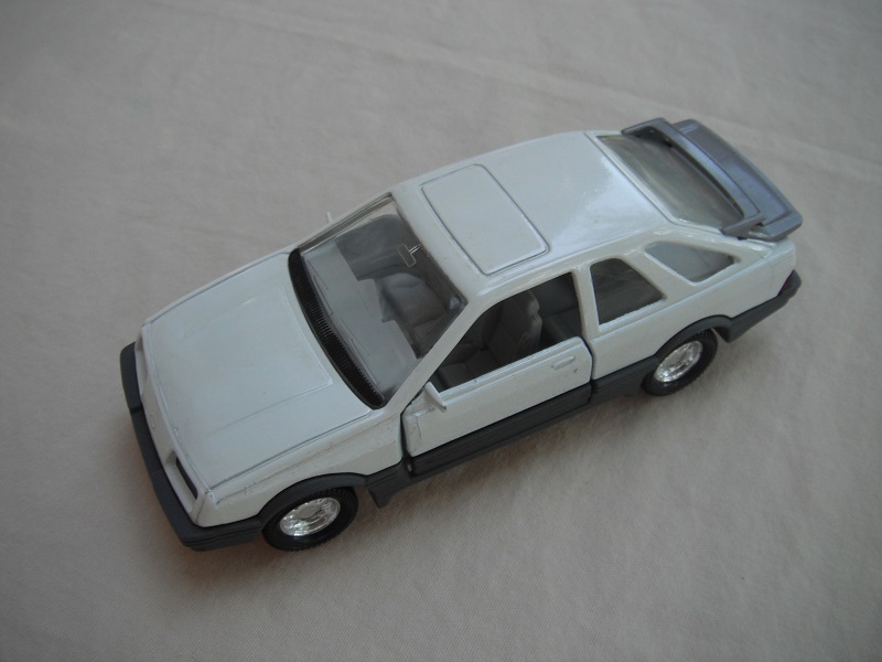 14. White body/gray spoiler/gray England base/8 dot chrome disc wheels/clear windows/gray int/black steering wheel.