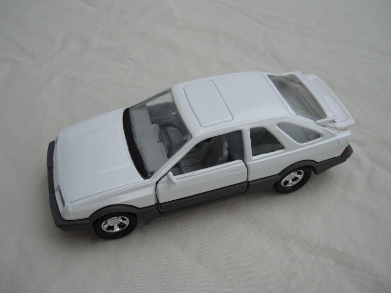 11. White body &amp; spoiler/gray England base/5 spoke mag wheels/clear windows/lt.gray int/black steering wheel.