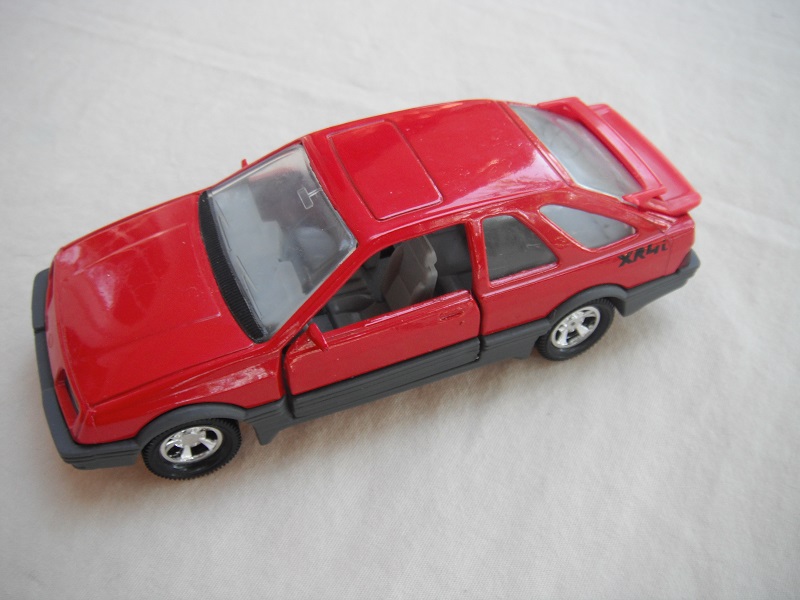 9. Red body &amp; spoiler/gray England base/5 spoke mag wheels/clear windows/lt.gray int/gray steering wheel/small XR4i no outline.