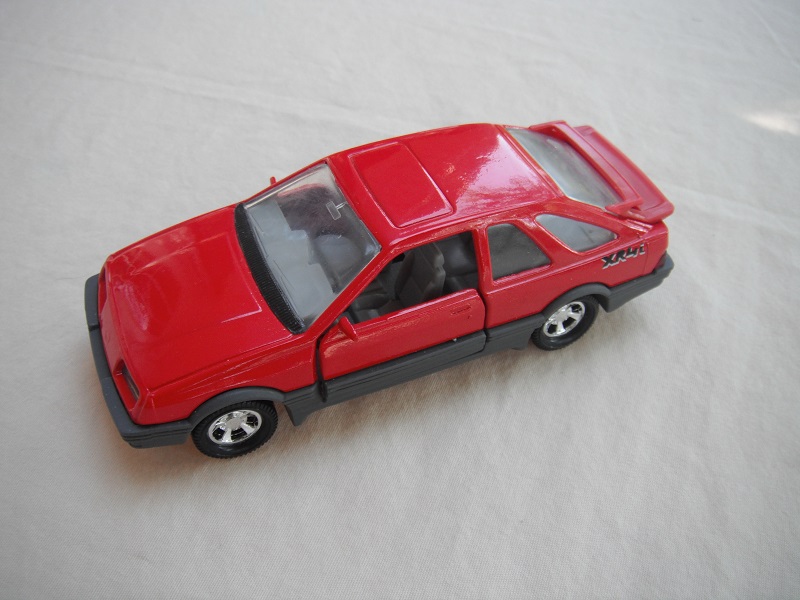 8. Red body &amp; spoiler/gray England base/5 spoke mag wheels/clear windows/lt.gray int/gray steering wheel/small XR4i w/outline.