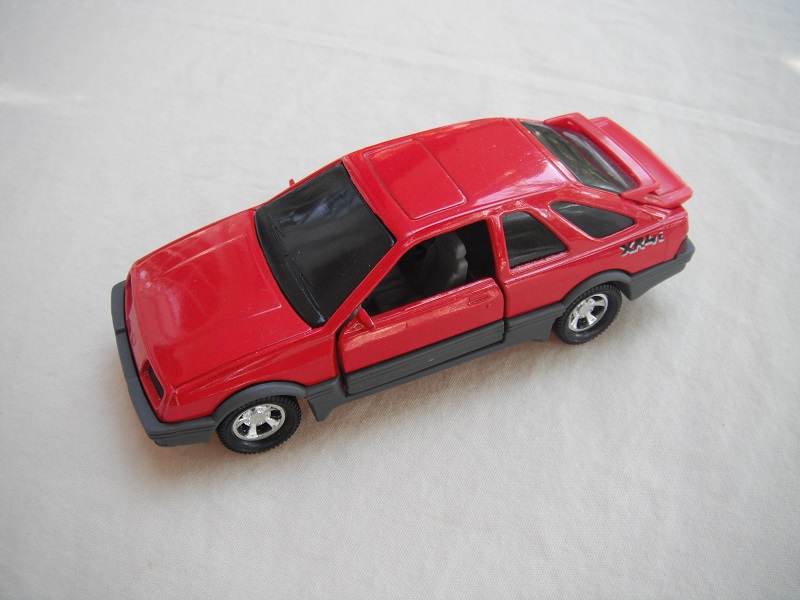 7. Red body &amp; spoiler/gray England base/5 spoke mag wheels/blackened windows/lt.gray int/gray steering wheel/small XR4i w/outline.