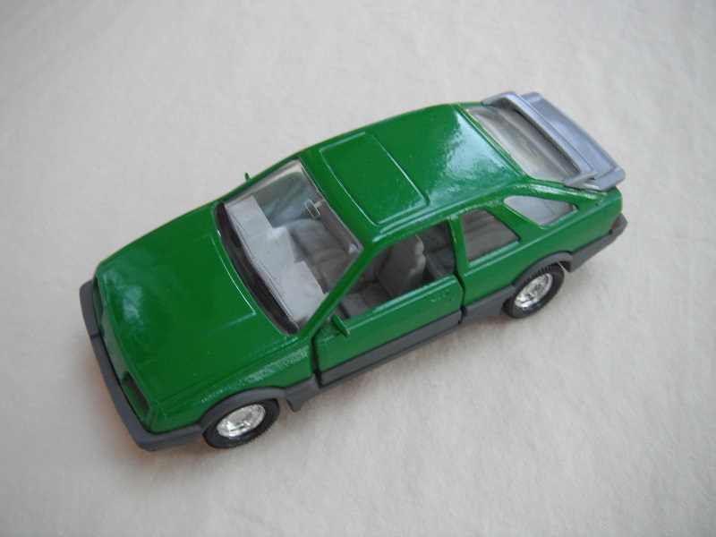 5. Green body/gray spoiler/gray England base/8 dot chrome disc wheels/clear windows/gray int/black steering wheel/PP.