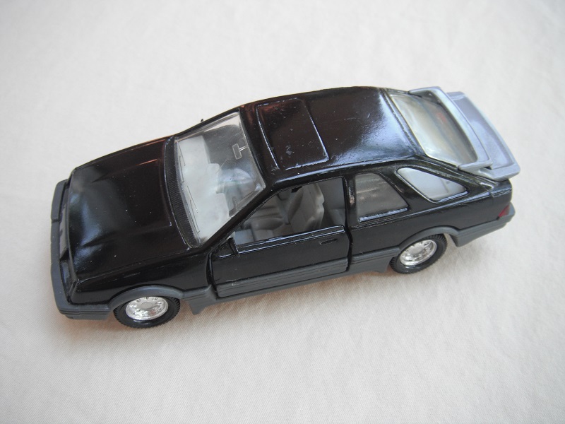 3. Black body/gray spoiler/black England base/8 dot chrome disc wheels/clear windows/gray int/black steering wheel/PP.