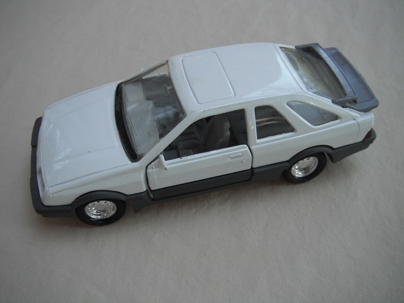 2. White body/gray spoiler/gray England base/8 dot chrome disc wheels/clear windows/gray int/black steering wheel/PP.
