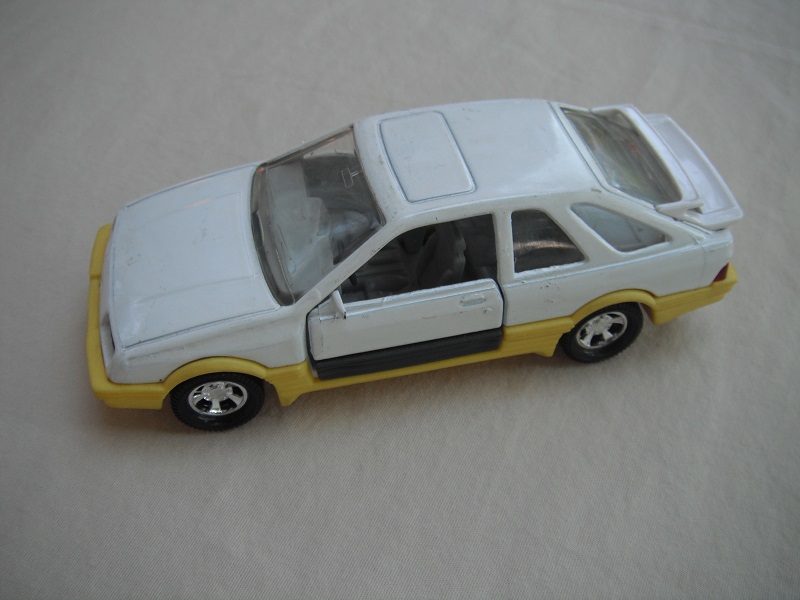 1. White body &amp; spoiler/yellow &amp; black England base/5 spoke mag wheels/clear windows/lt.gray int/black steering wheel/PP.