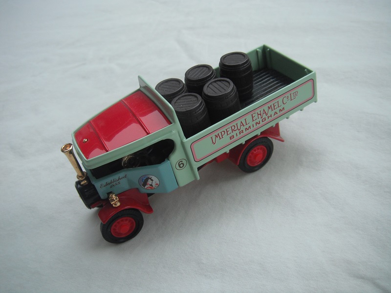 5. Pale blue cab/pale green body/red roof/red chassis/red base/YAS02/China/red disc wheels/load of barrels/No. 6.