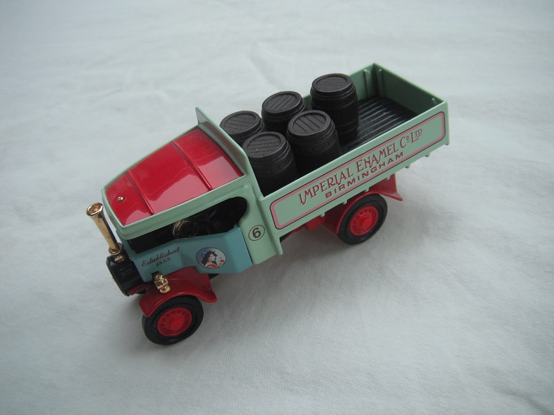 5. Pale blue cab/pale green body/red roof/red chassis/red base/YAS02/China/red disc wheels/load of barrels/No. 6.