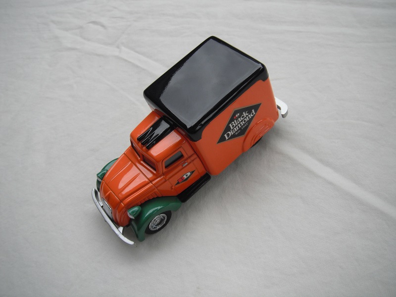 4. Orange cab/orange body/black roof/green fenders/green &amp; black base/China/chrome disc wheels/green headlights.