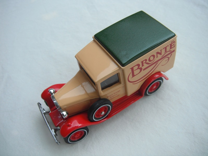 2. Model 'A' van/Cream body/green roof/red base/China/12 spoke red wheels.