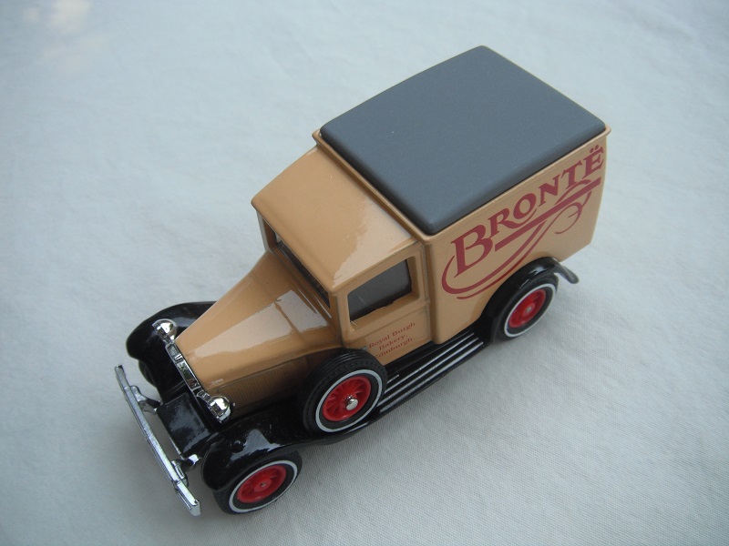 1. Model 'A' van/Cream body/gray roof/black base/China/12 spoke red wheels.