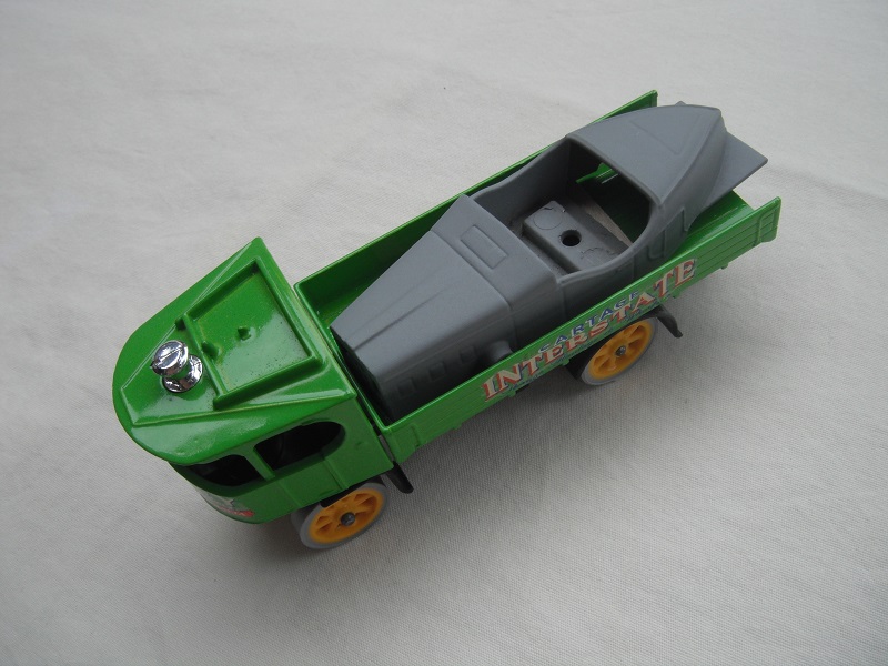 4. Green cab/long green bed/black base/yellow wheels/Auburn Speedster for load.